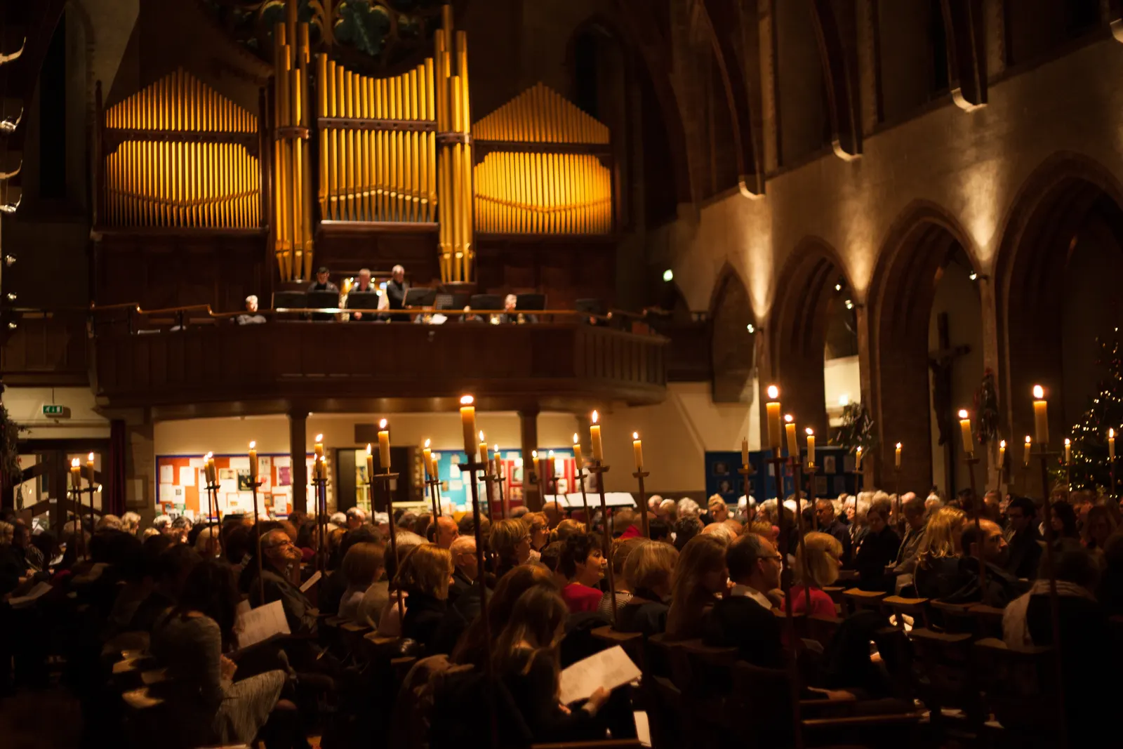 The nave of St Barnabas lit by candlelight