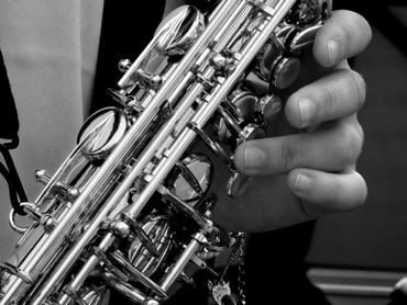 Close-up of a hand playing a saxophone