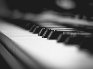 Close-up black-and-white photo of piano keys